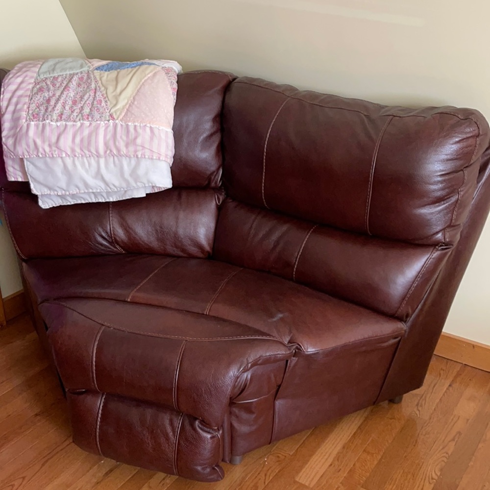 Genuine leather corner piece. Nothing wrong with it, just  taking up space.